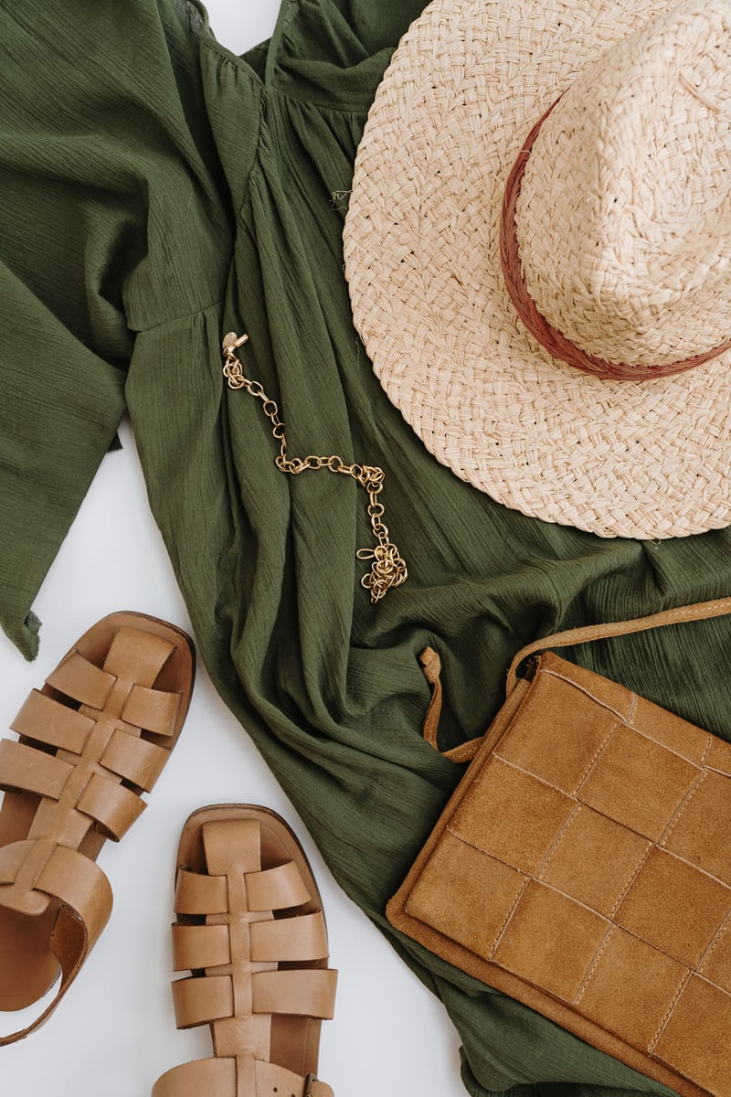 Straw Hat, Dress, Necklace, Bag, and Sandals Flatlay